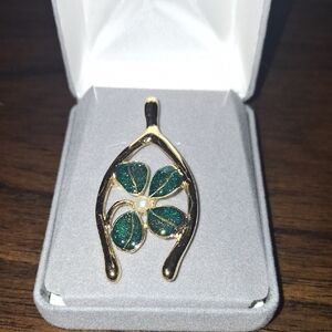 Elegant Gold and Green Wishbone Pendant